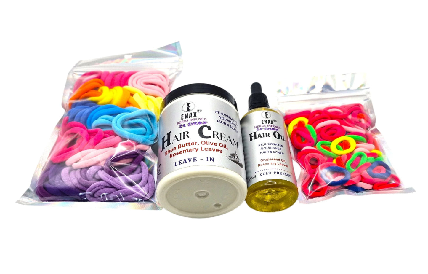 Children Care Pack3: ENAX Hair Cream, Hair Oil, Girl's Hair Ties & Toddler's Hair Ties. ENAX Girl's Hair Ties to the left, 300g jar of (ENAX) Hair Cream, 100ml bottle of (ENAX) Hair Oil in the middle. ENAX Baby & Toddler's Pink Hair Ties to the right. White background. Front Side.