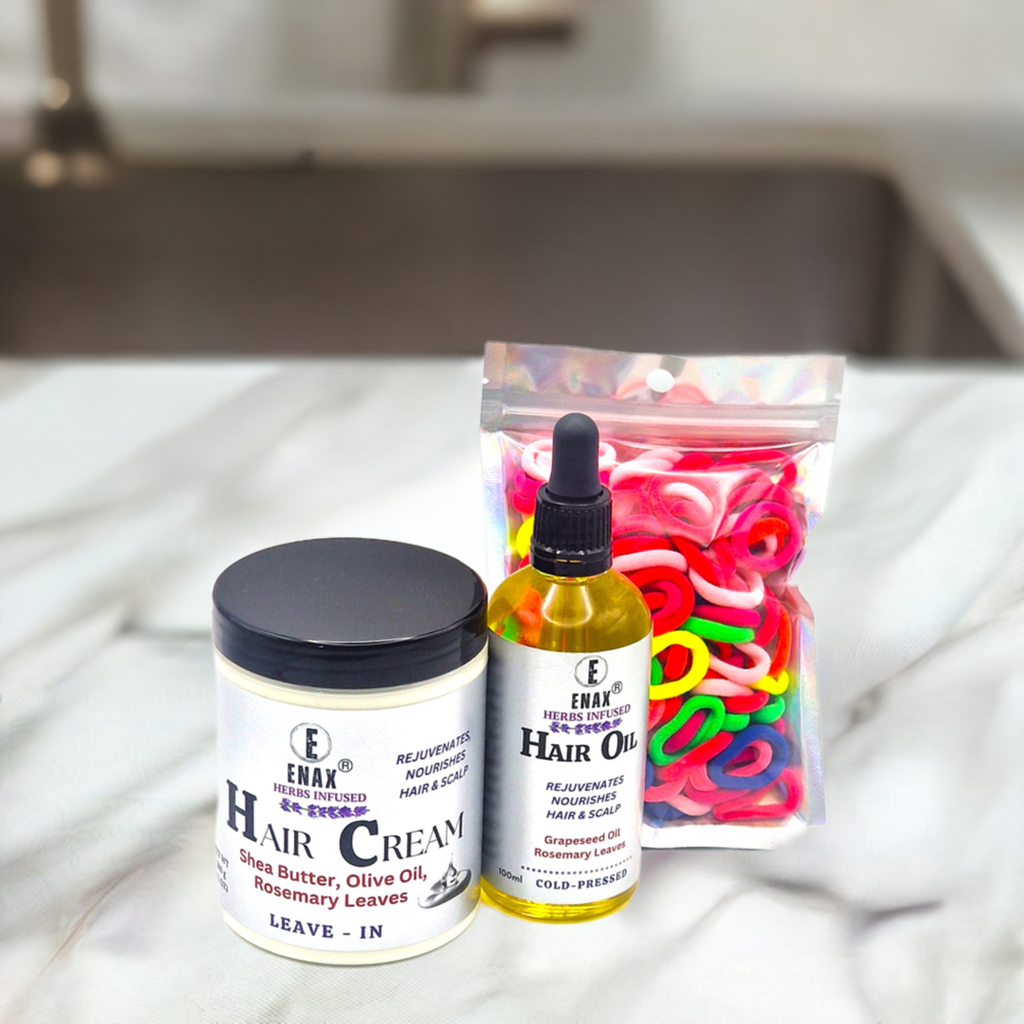 Children Care Pack1: ENAX Hair Cream, Hair Oil & Toddler's Hair Ties. 300g jar of (ENAX) Hair Cream to the left, 100ml bottle of (ENAX) Hair Oil in the middle, ENAX Baby & Toddler's Hair Ties to the far right. 120 small-sized pink Hair Ties. Marble countertop. Front Side.