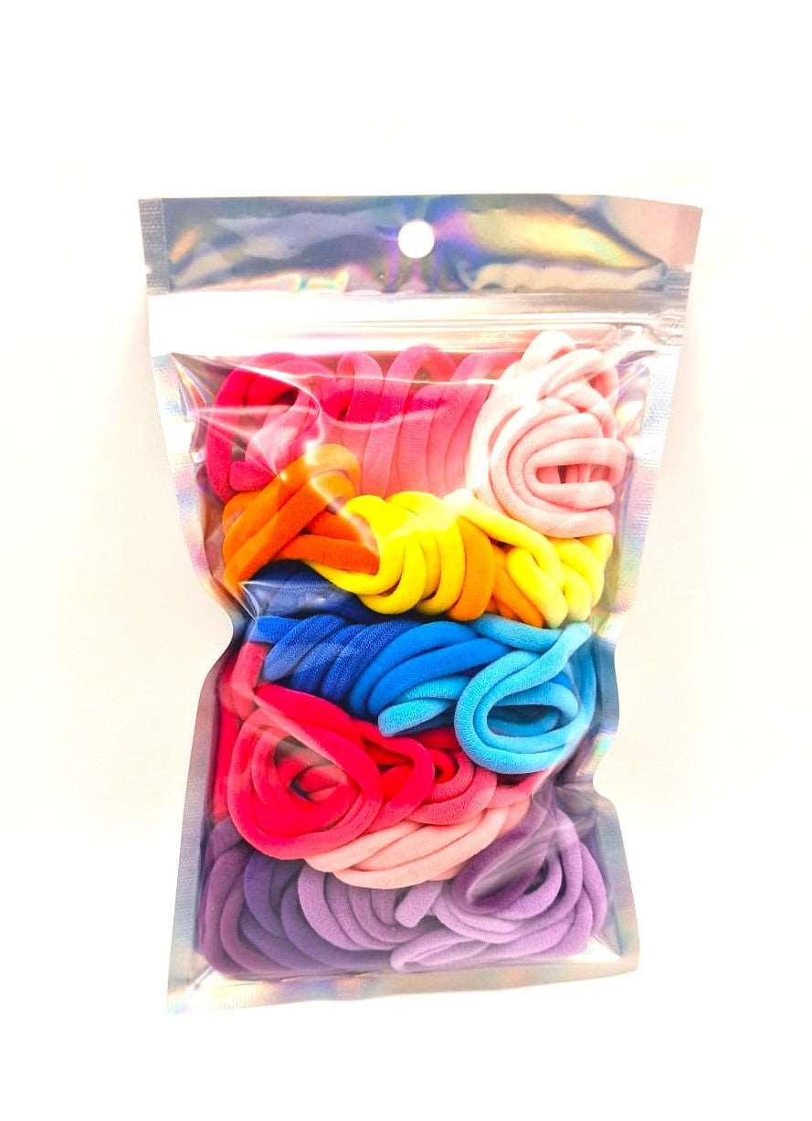 Girl's Hair Ties: ENAX Multi-Coloured Hair Bands, One silver pack of (ENAX) colorful medium-sized Hair Ties. 80 hair ties inside each pack. White background. Front Side.