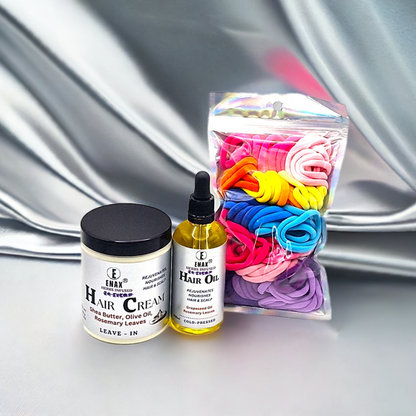 Children Care Pack2: ENAX Hair Cream, Hair Oil & Girl's Hair Ties. 300g jar of (ENAX) Hair Cream to the left, 100ml bottle of (ENAX) Hair Oil in the middle, One packet of (ENAX) Girl's Hair Ties to the far right. 80 medium-sized Multi-coloured hair ties inside packet. For Healthy Hair growth. Silver clothe wavy background. Front Side.