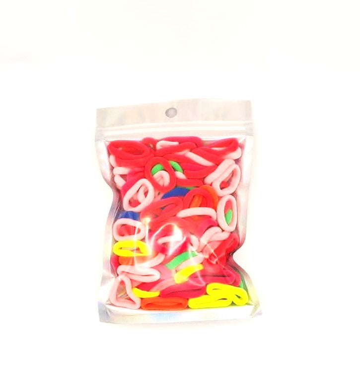 Baby & Toddler's Hair Ties: ENAX Hair Bands, One silver pack of (ENAX) colorful small sized Hair Ties. Mostly light and dark Pink coloured Hair Ties. 120 hair ties inside each pack, one pack in picture. Transparent front. Front Side.