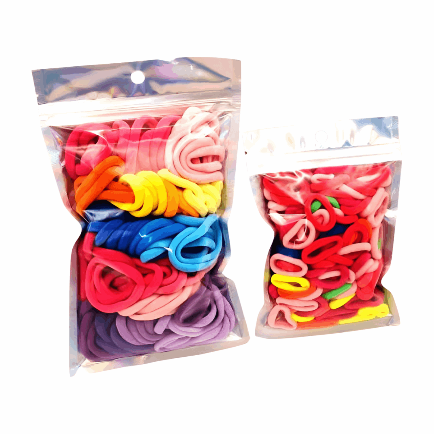 Girls & Baby's Hair Ties Pack of 2: ENAX Multi-Coloured Hair Bands. Two silver packets. First packet to the left consists of (ENAX) Girls Multi-Coloured, medium-sized Hair Ties. Second packet to the right consists of Baby & Toddler's Pink Hair Ties. 80 medium-sized Girls Multi-coloured hair ties and 120 Baby & Toddler's Pink Hair Ties, two packets inside picture. White background. Front Side.