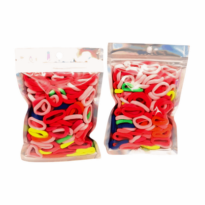 Baby & Toddler's Hair Ties Pack of 2: ENAX Hair Bands, Two silver packet of (ENAX) colorful small sized Hair Ties. Mostly light and dark Pink coloured Hair Ties. 120 hair ties inside each pack, two packets in picture. Transparent Front side.